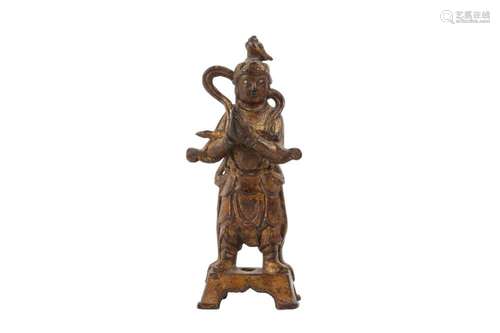 A CHINESE GILT-BRONZE FIGURE OF AN ATTENDANT.