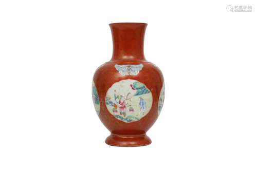 A CHINESE GILT-DECORATED SALMON-RED VASE.