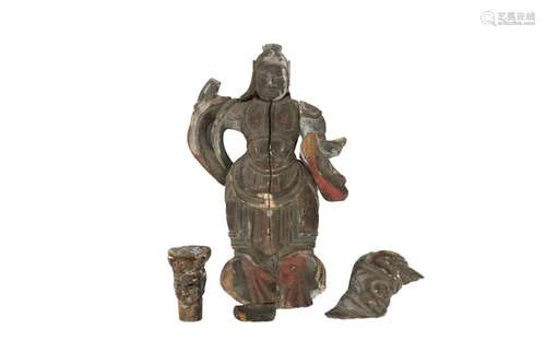 AN EARLY CHINESE POLYCHROME WOOD FIGURE OF A GUARDIAN.