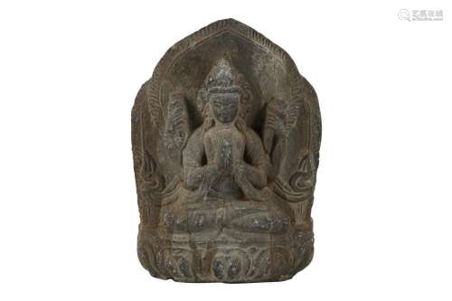 A SHIST RELIEF OF A FOUR-ARMED BODHISATTVA.