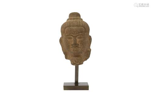 A KHMER STONE HEAD OF A BUDDHA.