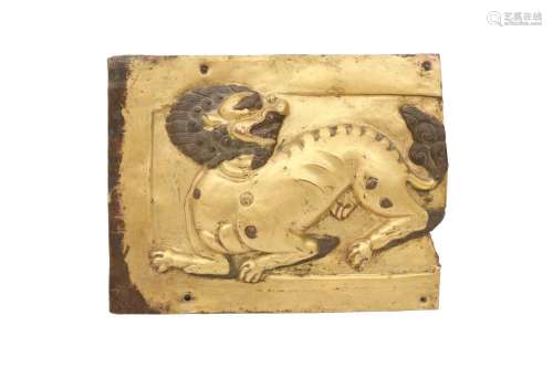 A TIBETAN GILT-COPPER REPOUSSE 'SNOW LION' PLAQUE.