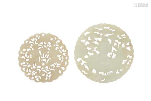 TWO CHINESE PALE CELADON JADE CIRCULAR PLAQUES.