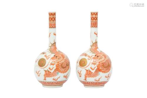 A PAIR OF CHINESE IRON-RED 'DRAGON' BOTTLE VASES.