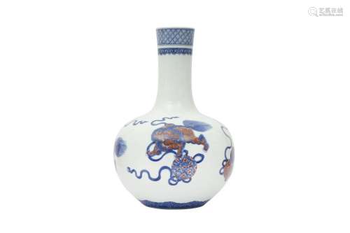 A CHINESE BLUE AND WHITE AND UNDERGLAZE RED 'LION DOGS&#...