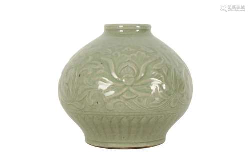 A CHINESE INCISED CELADON-GLAZED JAR.