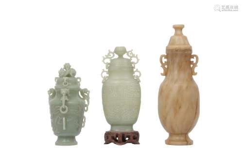 A COLLECTION OF THREE CHINESE CARVED JADE VASES AND COVERS.