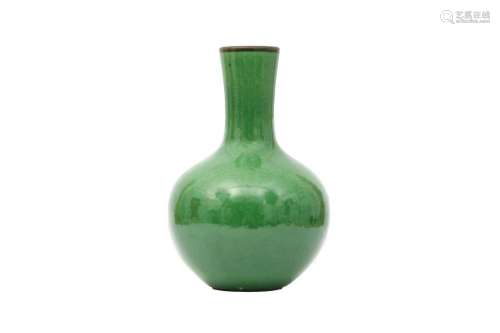 A CHINESE APPLE GREEN-GLAZED BOTTLE VASE