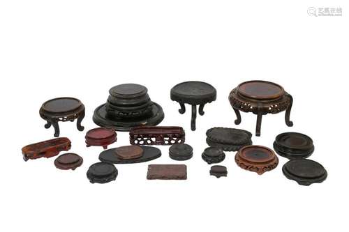 A COLLECTION OF CHINESE WOOD STANDS.