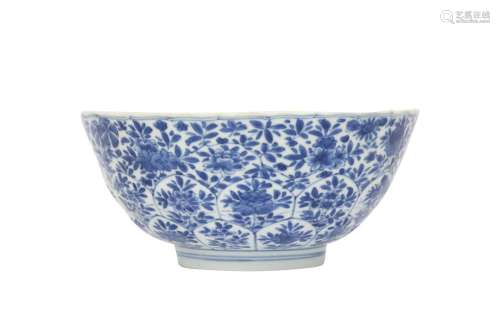 A CHINESE BLUE AND WHITE MOULDED 'BLOSSOMS' BOWL.