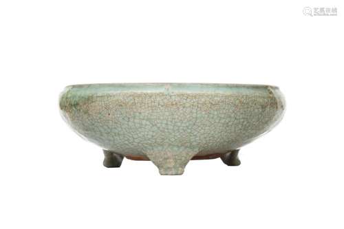 A CHINESE CELADON-GLAZED TRIPOD INCENSE BURNER.