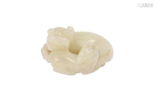 A CHINESE WHITE JADE 'LION DOG' GROUP.