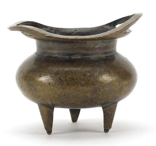 Chinese patinated bronze tripod incense burner with twin han...