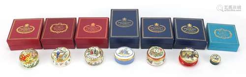 Seven enamel trinket boxes including six Halcyon Days exampl...