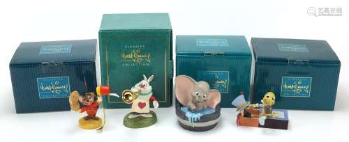 Four Walt Disney Classics Collection figures with boxes and ...