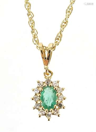 9ct gold emerald and diamond cluster pendant on a 9ct gold n...