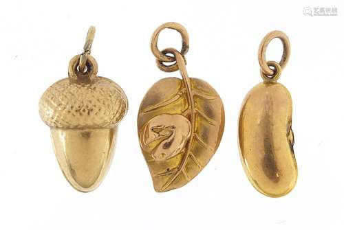 Three 9ct gold charms of an acorn, kidney bean and ladybug o...