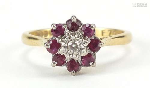 18ct gold diamond and ruby flower head ring, size M, 3.9g