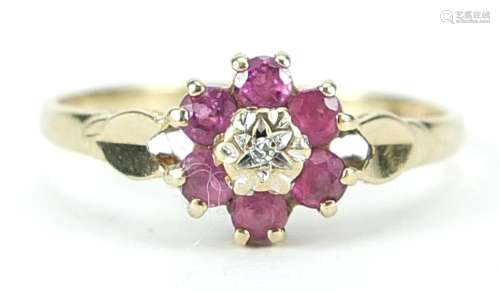 9ct gold ruby and diamond flower head ring, size P, 1.7g