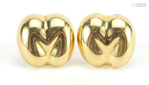 Pair of unmarked gold Coco de Mer stud earrings, the back fi...