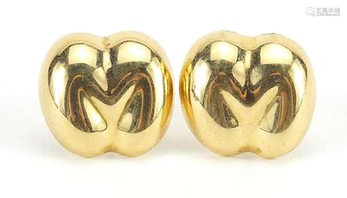 Pair of unmarked gold Coco de Mer stud earrings, the back fi...