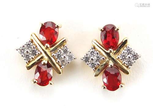 Pair of red and clear stone stud earrings, 1cm high, 2.5g