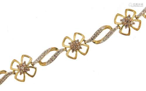 Silver gilt diamond flower head bracelet, 19cm in length, 7....