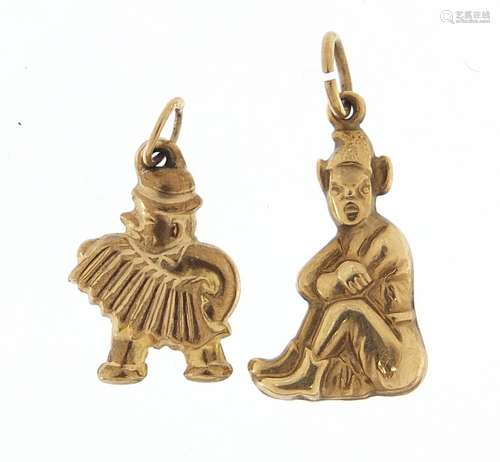 Two 9ct gold charms of a seated pixie and accordion player, ...