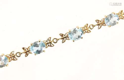 9ct gold blue topaz bracelet with certificate of authenticit...