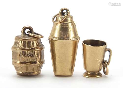 Three 9ct gold charms of a cocktail shaker, beer barrel and ...