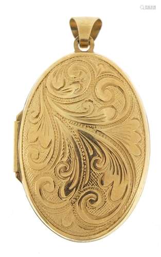 Oval 9ct gold locket engraved with foliage, 4cm high, 4.4g