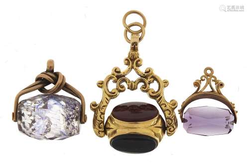 Three spinner fobs including one 9ct gold with carnelian and...