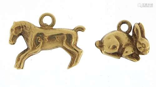 Two unmarked gold charms comprising a horse and rabbit, the ...