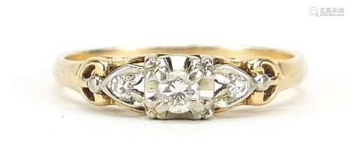 Unmarked gold diamond three stone ring with pierced shoulder...