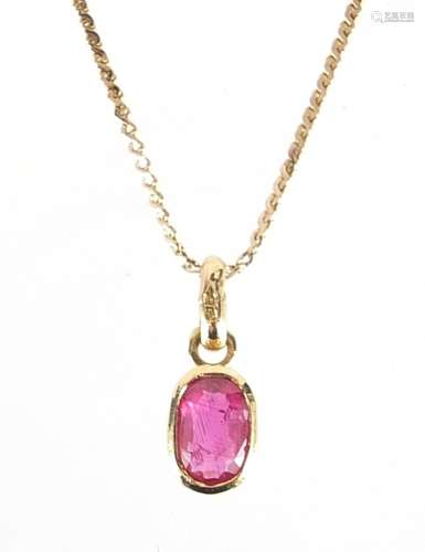 9ct gold ruby pendant on a 9ct gold necklace, 1.2cm high and...