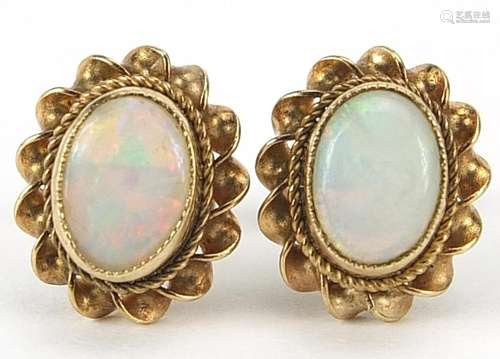 Pair of 9ct gold opal stud earrings, 1cm high, 1.8g