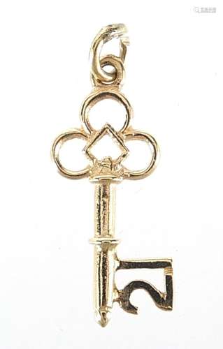 9ct gold 21 key charm, 2.1cm in length, 0.7g