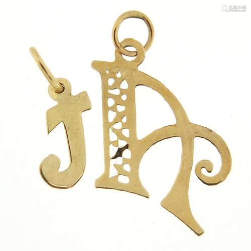 Two 9ct gold initial pendants, A and T, the largest 1.9cm hi...