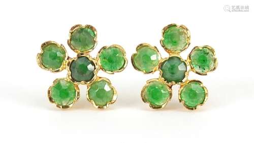 Pair of 9ct gold emerald flower head stud earrings, 1.1cm in...
