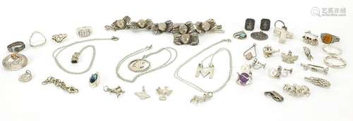 Silver and white metal jewellery including charms, rings and...