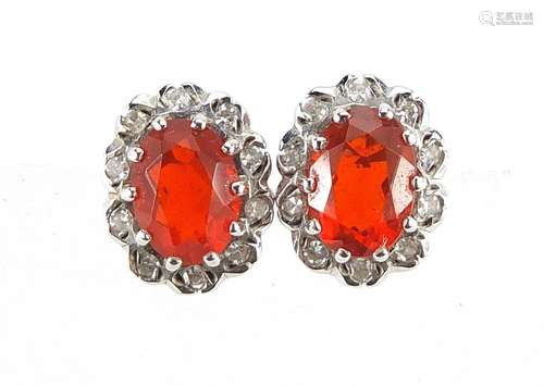 Pair of 9ct gold Mexican fire opal and diamond cluster stud ...