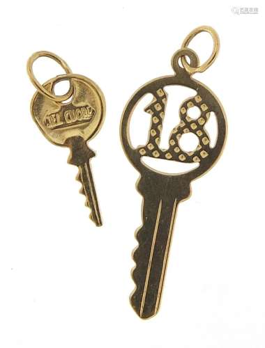 Two unmarked gold key charms including no 18, the largest 2....
