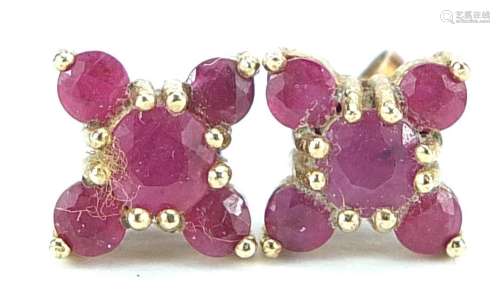 Pair of 9ct gold ruby cluster stud earrings, 1cm in diameter...