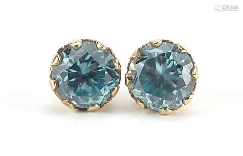 Pair of 9ct gold blue zircon stud earrings, 6mm in diameter,...