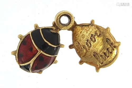 Unmarked gold and enamel ladybug charm with hidden good luck...
