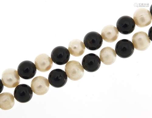 Cultured pearl and black bead necklace, 120cm in length, 111...