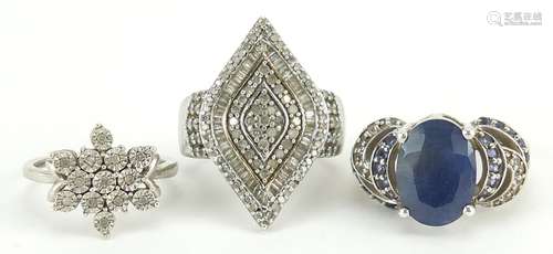 Three silver diamond and sapphire cluster rings, sizes N and...