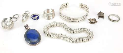 Silver jewellery including a charm bracelet, bangle, spoon d...