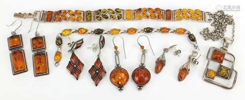 Silver natural amber jewellery comprising two bracelets, pen...