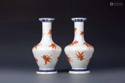 A PAIR OF BLUE AND WHITE IRON-RED GLAZED VASES
